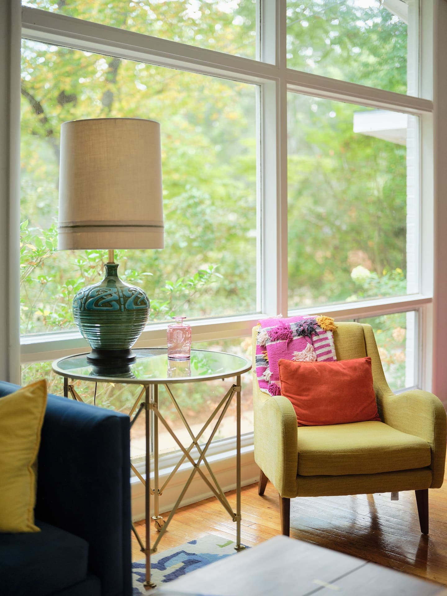 Living room gallery wall with mid-century seating